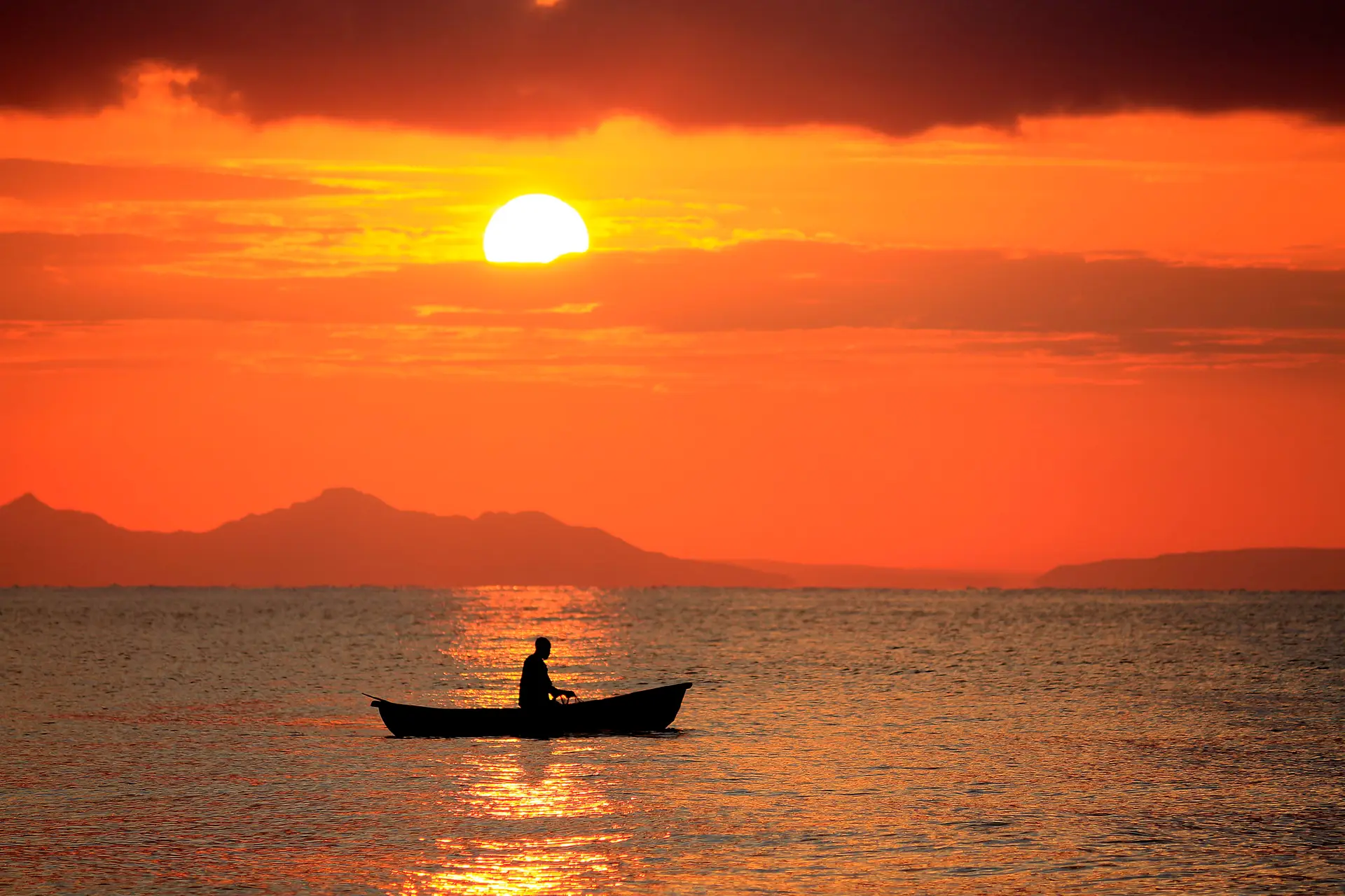 Sunset sunrise lake Malawi fisherman boat fishing Africa water people